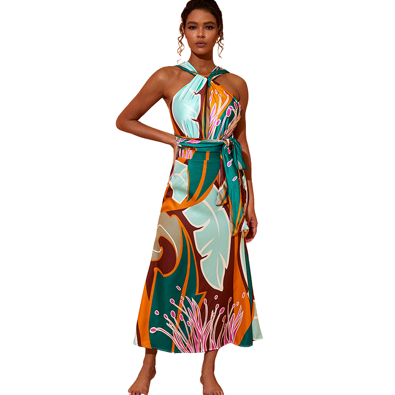 Conjunto Maiô feminino e Saída de Praia com estampa abstrata em tons de verde, marrom e rosa, com faixa marcando a cintura.