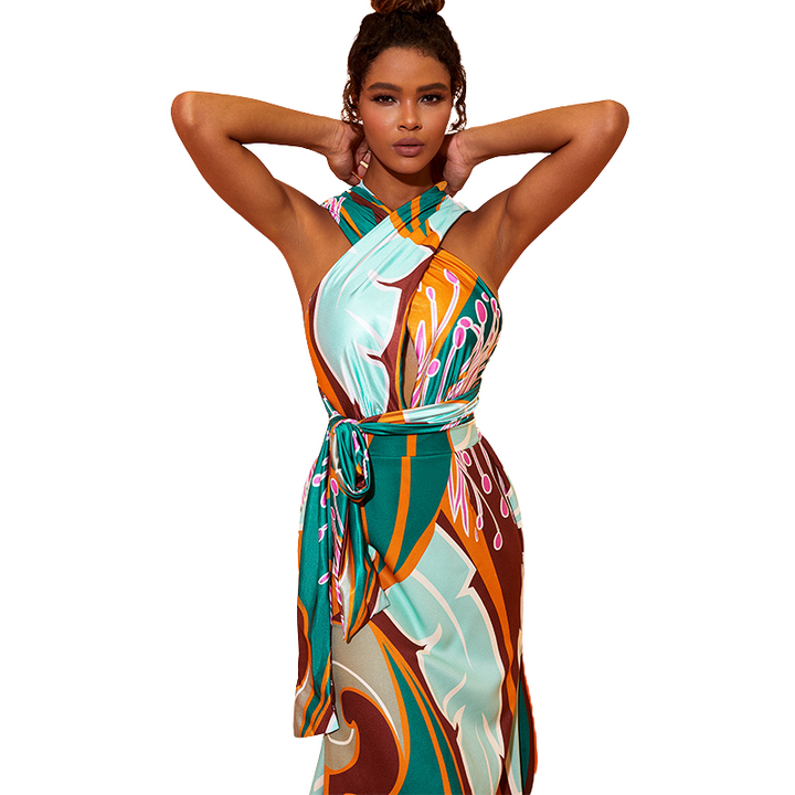 Maiô feminino e Saída de Praia com estampa abstrata em tons de verde, marrom e rosa, com faixa marcando a cintura.